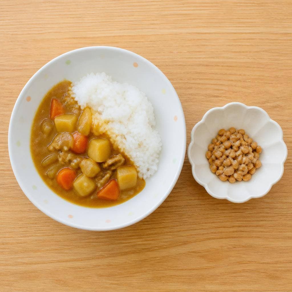 生成された食卓イメージ：カレーライス、納豆